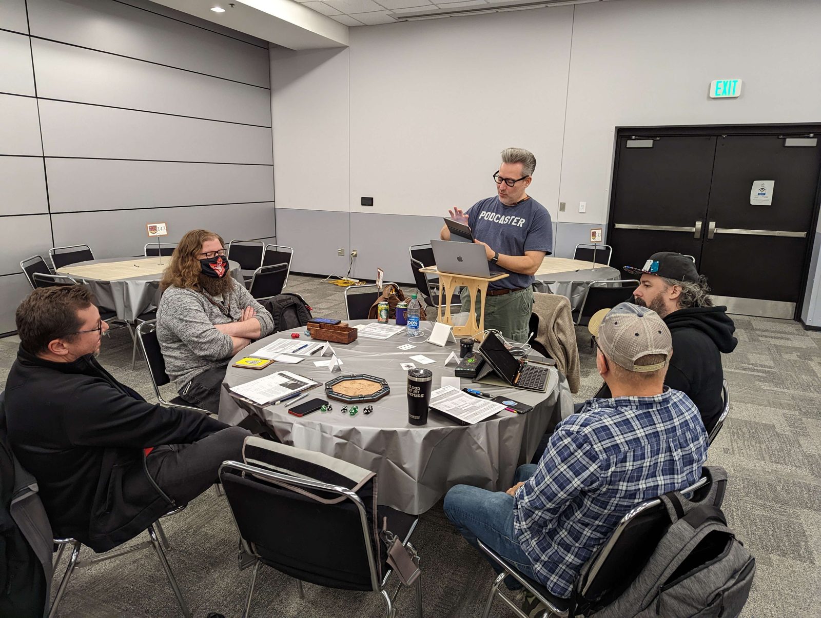 Sean running a convention game for four players at a round table